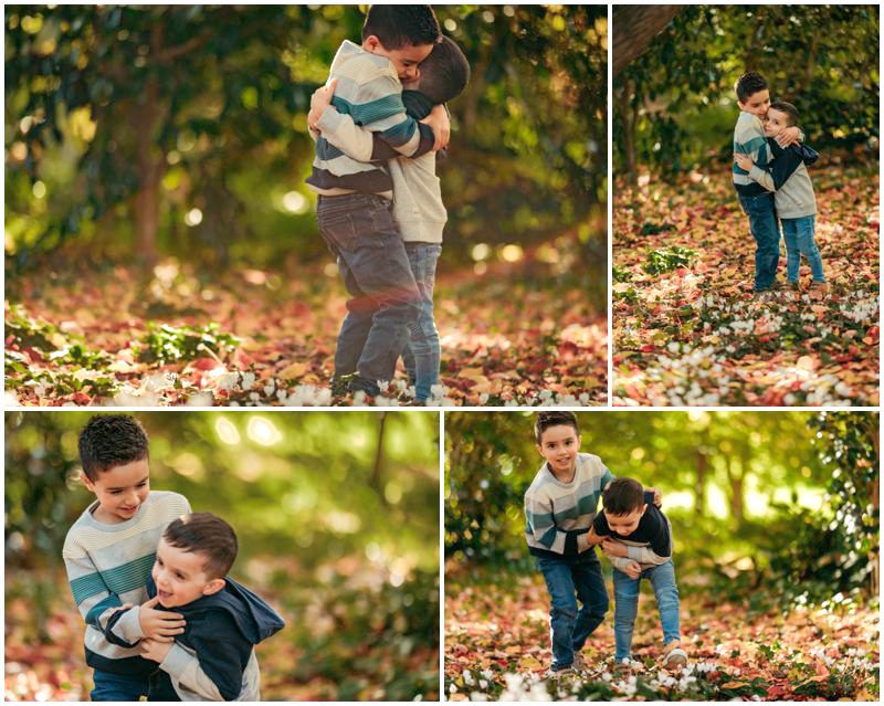 Joyful Autumn Canberra Family Photo Shoot with Two Children Leading the Way Through a Trail of Colorful Fallen Leaves_0004